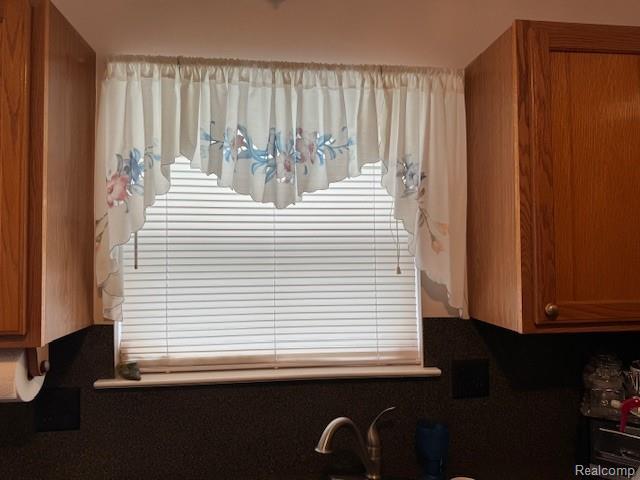 912 Rikki Anne Ct, Wixom, MI 48393 - detailed view of brown cabinetry