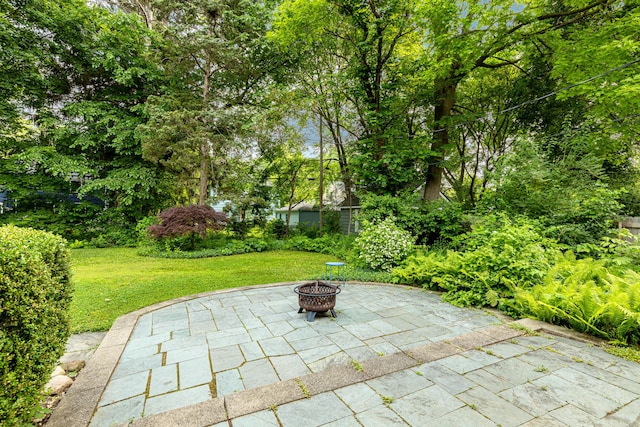 1208 Whittier Rd, Ypsilanti, MI 48197 - view of patio / terrace featuring a fire pit