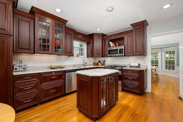 1208 Whittier Rd, Ypsilanti, MI 48197 - kitchen featuring appliances with stainless steel finishes, light wood finished floors, healthy amount of natural light, and recessed lighting
