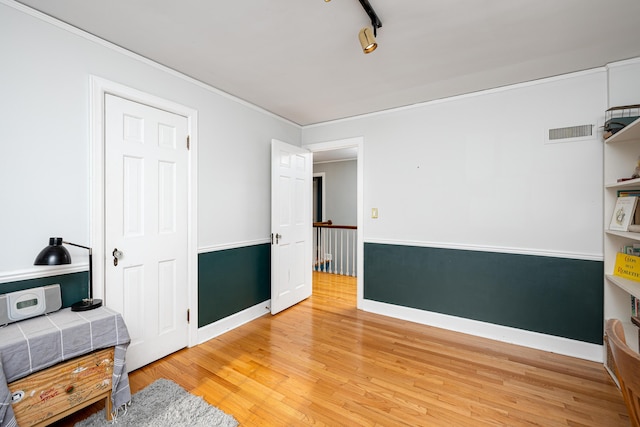 1208 Whittier Rd, Ypsilanti, MI 48197 - home office featuring light wood-style flooring and ornamental molding