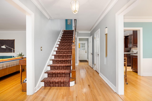 1208 Whittier Rd, Ypsilanti, MI 48197 - stairs featuring wood finished floors and crown molding