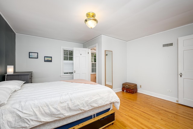 1208 Whittier Rd, Ypsilanti, MI 48197 - bedroom with light wood finished floors and ornamental molding