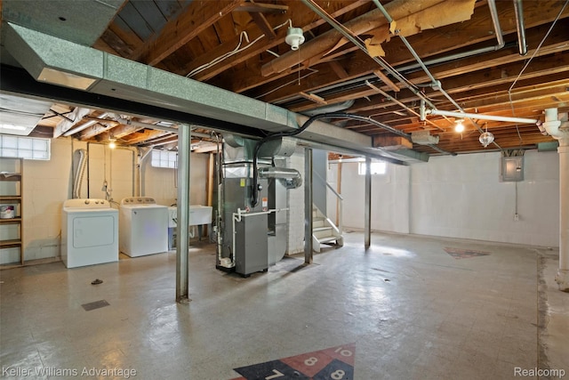 3434 Campbell St, Dearborn, MI 48124 - basement featuring heating unit, washing machine and clothes dryer, electric panel, and tile patterned floors