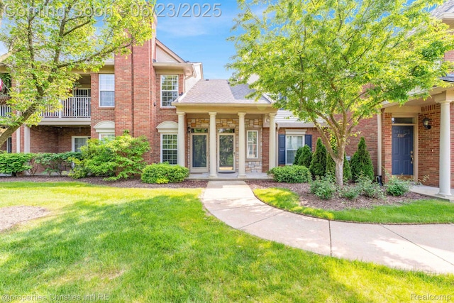 3581 Oakmonte Blvd Unit 60, Rochester, MI 48306 - view of front of property featuring a front lawn and brick siding