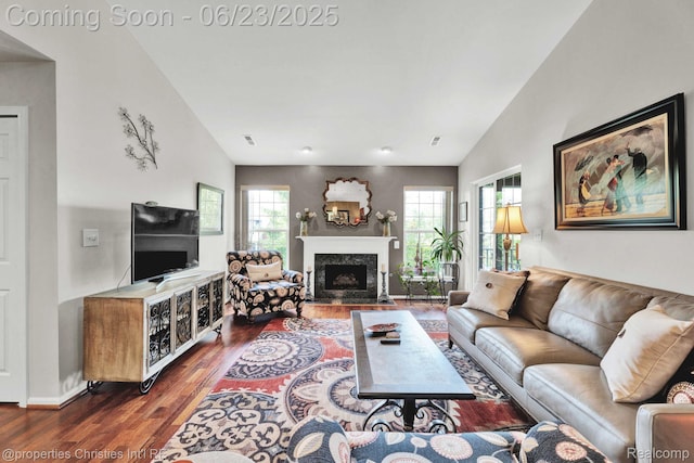 3581 Oakmonte Blvd Unit 60, Rochester, MI 48306 - living room featuring a fireplace with flush hearth, wood finished floors, and vaulted ceiling