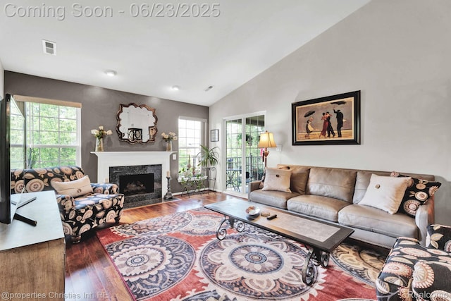 3581 Oakmonte Blvd Unit 60, Rochester, MI 48306 - living area featuring wood finished floors, a high end fireplace, and vaulted ceiling