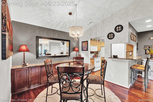 3581 Oakmonte Blvd Unit 60, Rochester, MI 48306 - dining space featuring a chandelier, dark wood-style floors, and recessed lighting