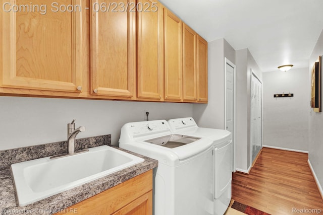 3581 Oakmonte Blvd Unit 60, Rochester, MI 48306 - laundry area featuring washing machine and dryer, wood finished floors, and cabinet space