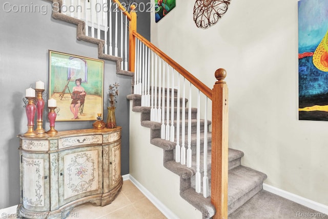 3581 Oakmonte Blvd Unit 60, Rochester, MI 48306 - staircase featuring baseboards and tile patterned floors