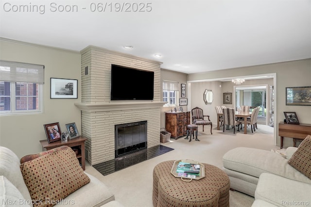 25845 Salem Rd, Huntington Woods, MI 48070 - living area featuring carpet floors, a chandelier, a fireplace, crown molding, and recessed lighting
