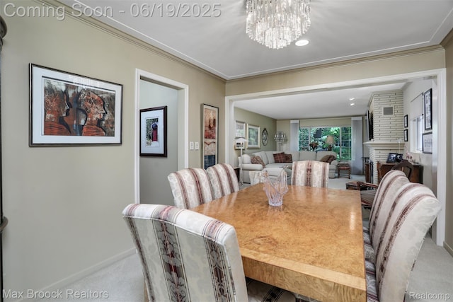 25845 Salem Rd, Huntington Woods, MI 48070 - dining area featuring carpet, a chandelier, ornamental molding, and a fireplace
