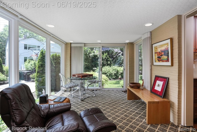 25845 Salem Rd, Huntington Woods, MI 48070 - sunroom / solarium with a textured ceiling, a wall of windows, recessed lighting, and carpet floors