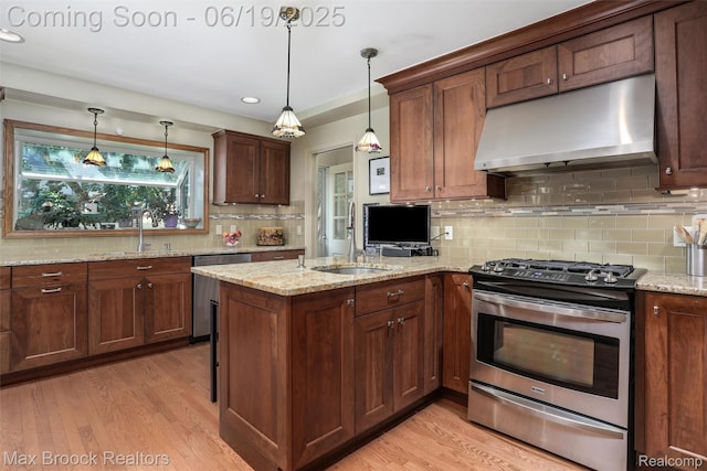 25845 Salem Rd, Huntington Woods, MI 48070 - kitchen featuring stainless steel appliances, under cabinet range hood, decorative backsplash, a peninsula, and light wood-style floors