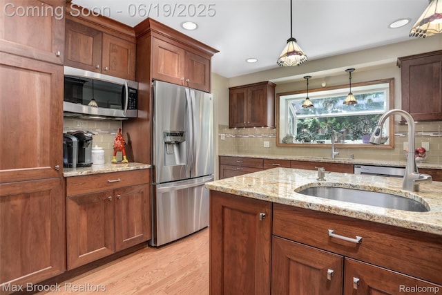 25845 Salem Rd, Huntington Woods, MI 48070 - kitchen featuring stainless steel appliances, decorative backsplash, decorative light fixtures, light wood-type flooring, and recessed lighting