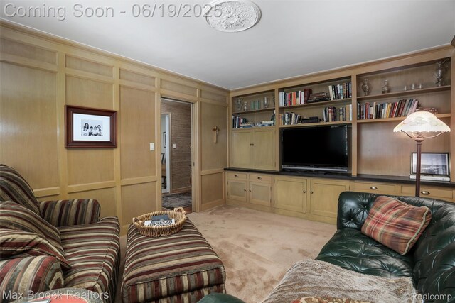 25845 Salem Rd, Huntington Woods, MI 48070 - living area with light carpet, a decorative wall, and ornamental molding