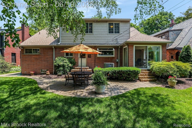 25845 Salem Rd, Huntington Woods, MI 48070 - rear view of house featuring brick siding, a patio area, and a yard