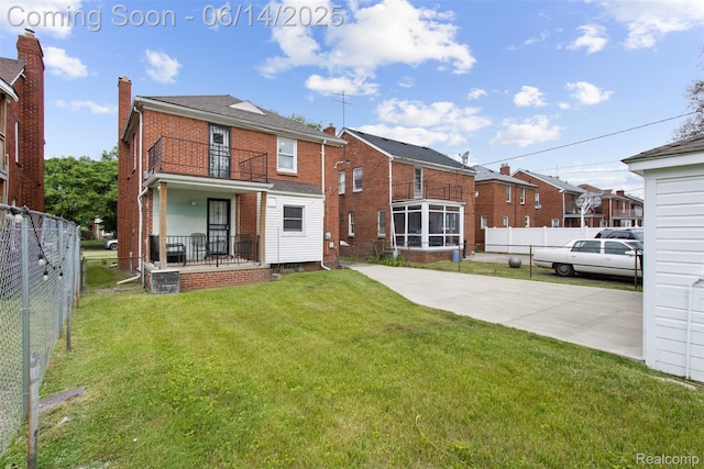 16136 Whitcomb St, Detroit, MI 48235 - rear view of property featuring a balcony, brick siding, a chimney, and a residential view