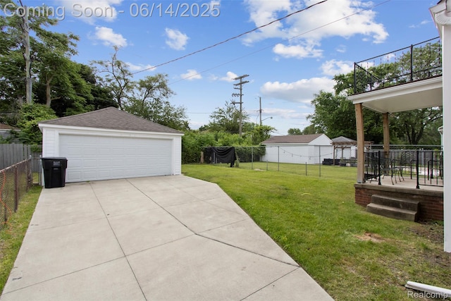16136 Whitcomb St, Detroit, MI 48235 - view of yard with a detached garage, an outbuilding, and a balcony