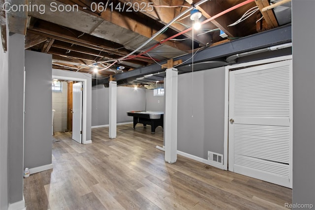16136 Whitcomb St, Detroit, MI 48235 - below grade area featuring pool table, wood finished floors, and plenty of natural light