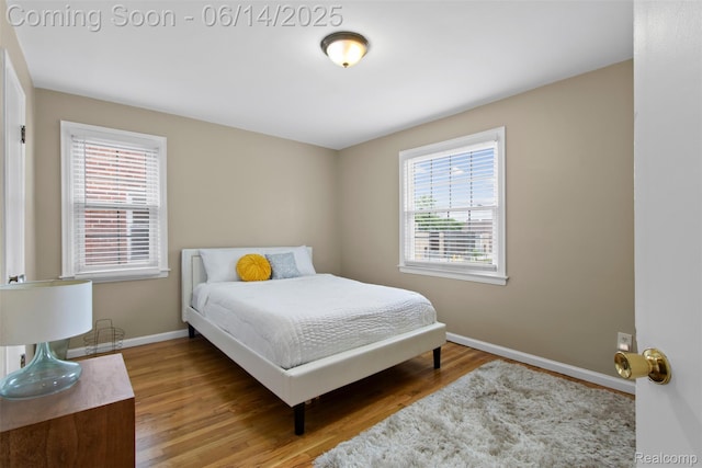 16136 Whitcomb St, Detroit, MI 48235 - bedroom featuring multiple windows and wood finished floors