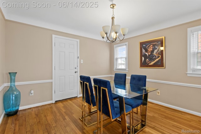 16136 Whitcomb St, Detroit, MI 48235 - dining room with a chandelier, wood finished floors, and plenty of natural light