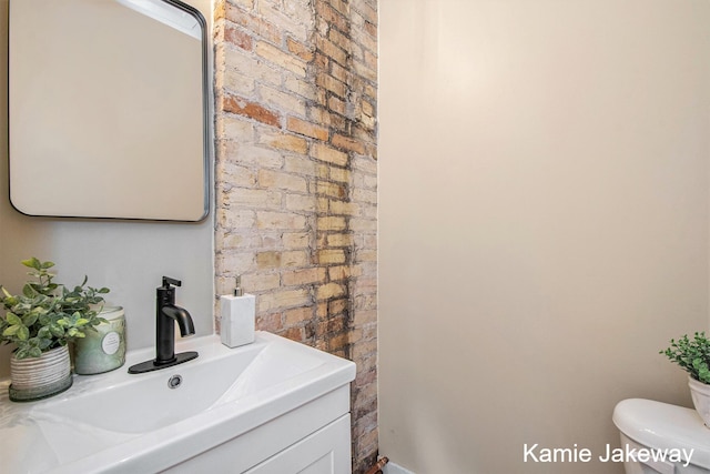 947 W Main St, Ionia, MI 48846 - bathroom featuring toilet and vanity