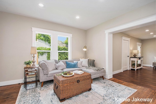 947 W Main St, Ionia, MI 48846 - living area with wood finished floors, recessed lighting, and baseboard heating