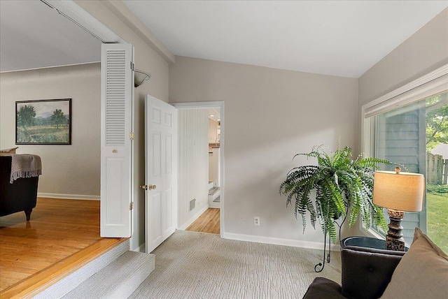 1115 Keneberry Way SE, East Grand Rapids, MI 49506 - living area with baseboards and vaulted ceiling