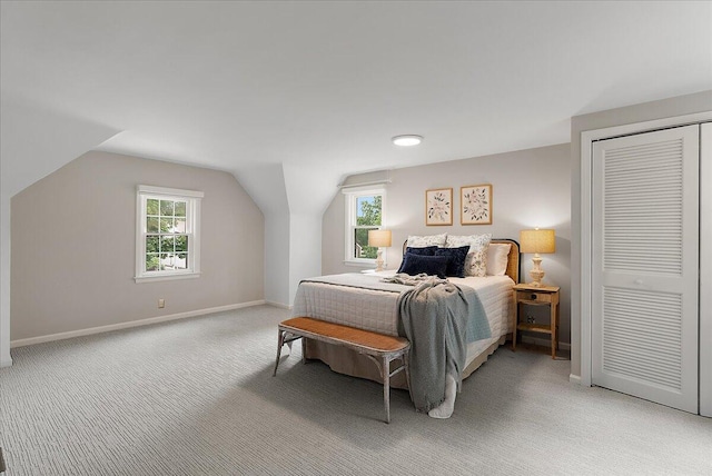 1115 Keneberry Way SE, East Grand Rapids, MI 49506 - bedroom featuring light colored carpet, lofted ceiling, and a closet
