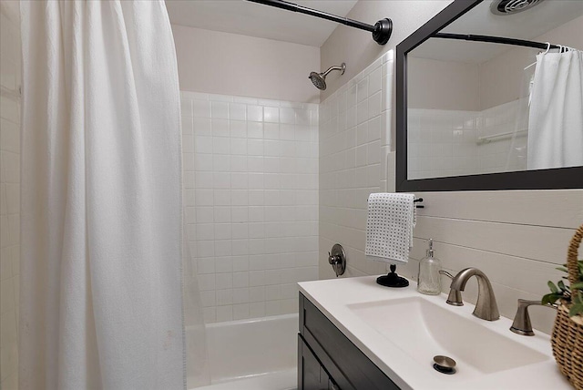 1115 Keneberry Way SE, East Grand Rapids, MI 49506 - bathroom with shower / bath combo with shower curtain, vanity, and tasteful backsplash