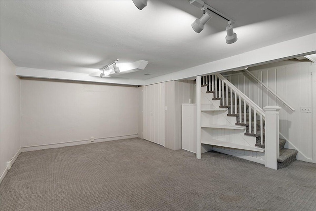 1115 Keneberry Way SE, East Grand Rapids, MI 49506 - finished below grade area featuring carpet flooring, stairs, and track lighting