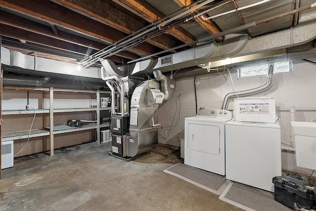 1115 Keneberry Way SE, East Grand Rapids, MI 49506 - below grade area with washing machine and clothes dryer and heating unit