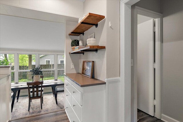 1115 Keneberry Way SE, East Grand Rapids, MI 49506 - interior space featuring dark wood-style floors, white cabinetry, and open shelves