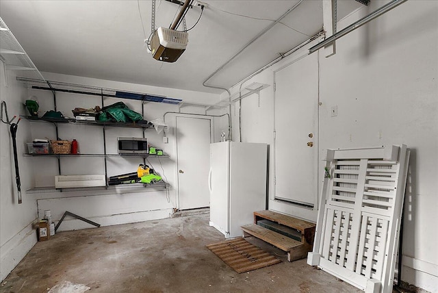 1115 Keneberry Way SE, East Grand Rapids, MI 49506 - garage featuring freestanding refrigerator and a garage door opener