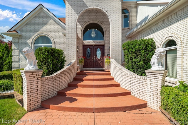 13205 Van Pamel Dr, Shelby Twp, MI 48315 - doorway to property featuring brick siding