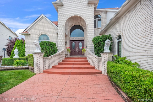 13205 Van Pamel Dr, Shelby Twp, MI 48315 - property entrance with brick siding