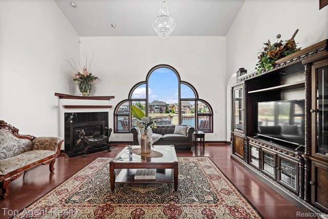 13205 Van Pamel Dr, Shelby Twp, MI 48315 - living room featuring a high ceiling, wood finished floors, and a fireplace