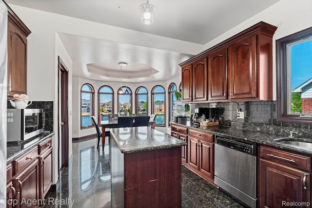 13205 Van Pamel Dr, Shelby Twp, MI 48315 - kitchen with stainless steel appliances, a center island, granite tiled floors, and backsplash