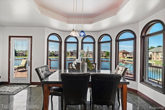 13205 Van Pamel Dr, Shelby Twp, MI 48315 - dining room with granite tiled floors, a water view, and a raised ceiling