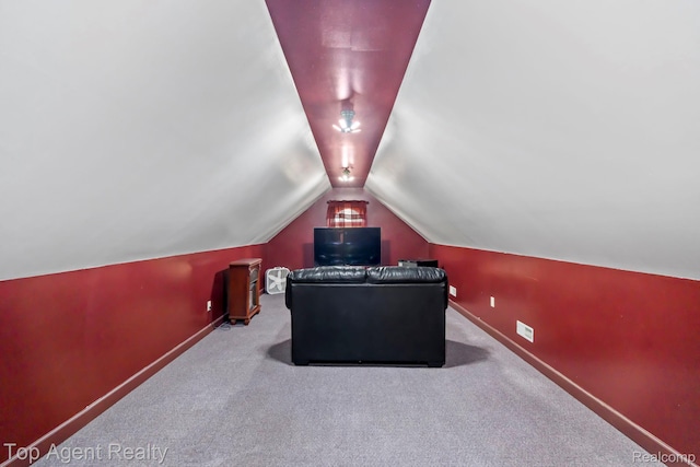 13205 Van Pamel Dr, Shelby Twp, MI 48315 - carpeted cinema room with vaulted ceiling and baseboards