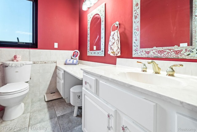 13205 Van Pamel Dr, Shelby Twp, MI 48315 - bathroom with vanity, tile patterned flooring, wainscoting, and tile walls