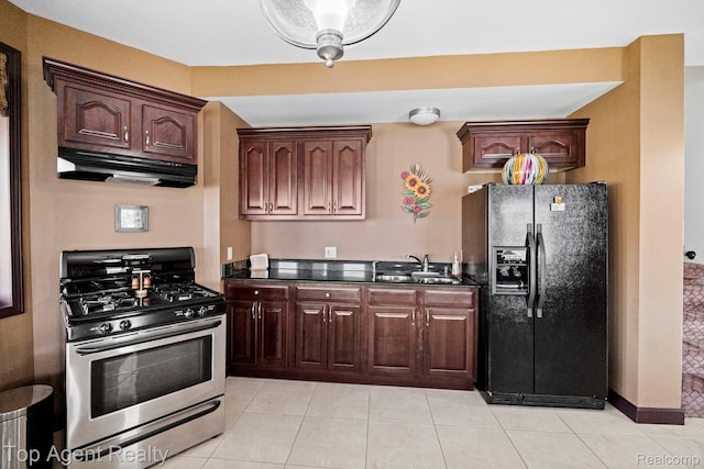 13205 Van Pamel Dr, Shelby Twp, MI 48315 - kitchen featuring gas range, black fridge, under cabinet range hood, dark countertops, and light tile patterned flooring