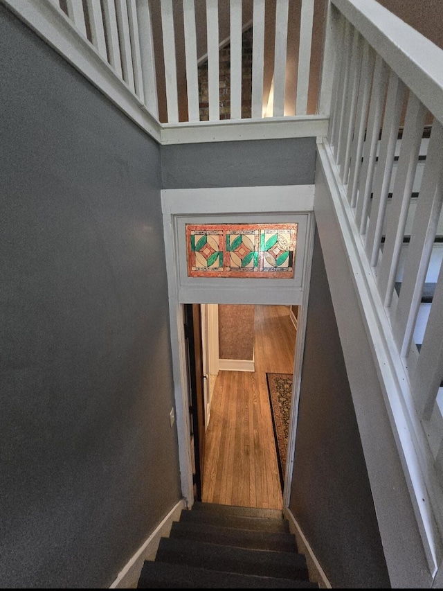 106 E Mechanic St, Yale, MI 48097 - staircase featuring wood finished floors and baseboards