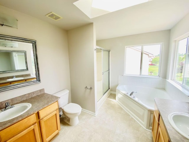 1924 Savannah Ln, Ypsilanti, MI 48198 - bathroom featuring vanity, a shower stall, a bath, and a skylight