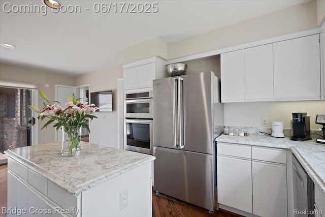 22025 Orchard Way, Beverly Hills, MI 48025 - kitchen featuring stainless steel appliances, white cabinets, a kitchen island, dark wood-style flooring, and light stone countertops