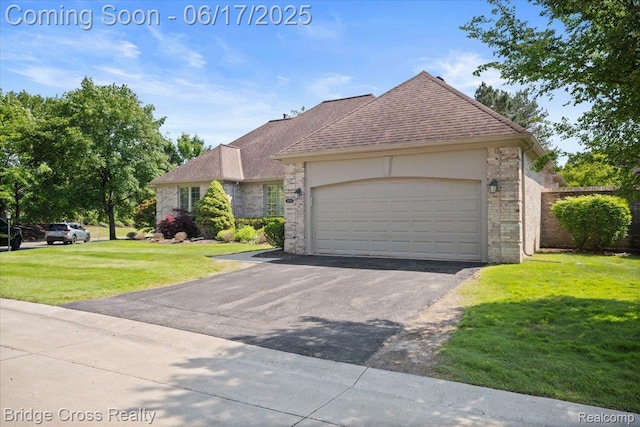 22025 Orchard Way, Beverly Hills, MI 48025 - view of front of home with a front lawn, asphalt driveway, a garage, and a shingled roof
