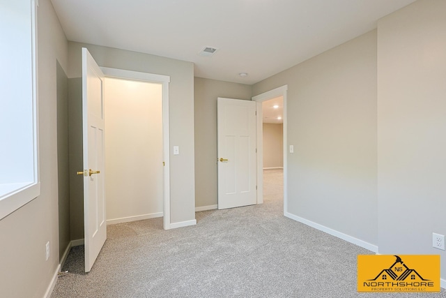 3973 W Harrison Rd, Hart, MI 49420 - unfurnished bedroom with light colored carpet and baseboards