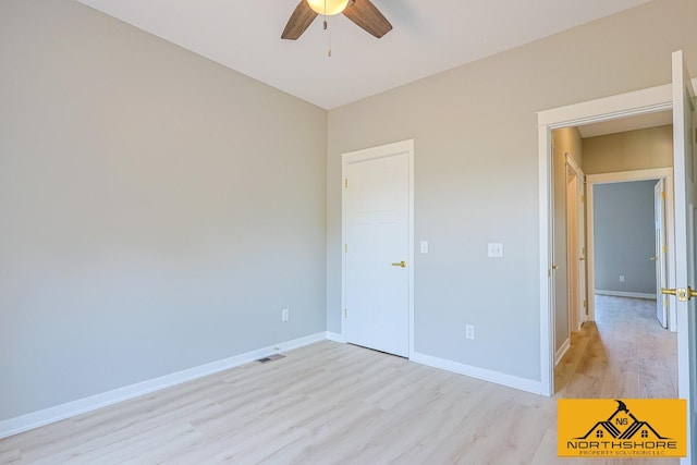 3973 W Harrison Rd, Hart, MI 49420 - unfurnished bedroom with light wood-style floors and a ceiling fan