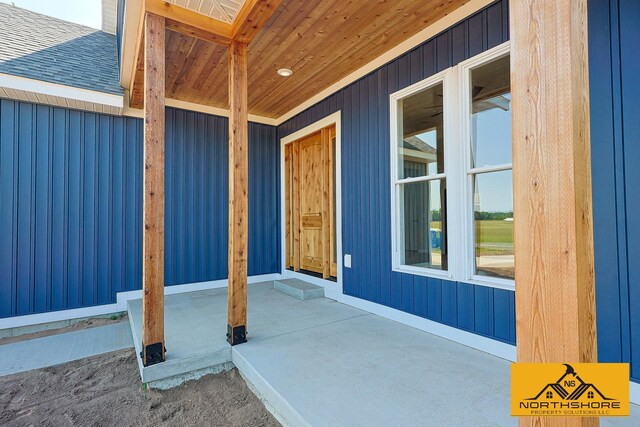 3973 W Harrison Rd, Hart, MI 49420 - view of exterior entry with a shingled roof and a porch