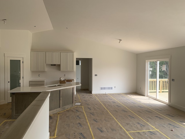 3094 Timberpine Ave, Holland, MI 49424 - kitchen with white cabinets and high vaulted ceiling